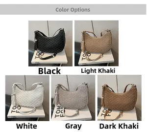 Detailed display of five color options for woven hobo bags with tassel decorations