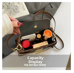 Internal view of brown leopard print bag showing large capacity for phone and makeup