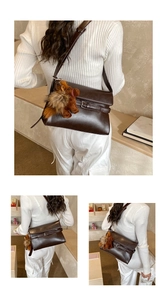 Three-way view of a dark brown crossbody bag with a horse plush charm on model