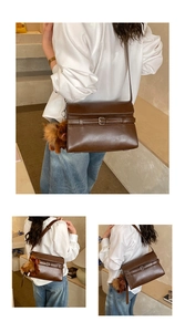 Macro detail of dark brown retro leather tote bag with metallic buckle and plush charm