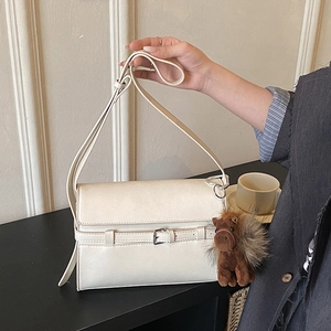 Retro cream white faux leather shoulder bag with buckle detail and plush horse charm