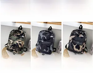 Detailed views of camouflage nylon backpacks in army green, grey, and black colors