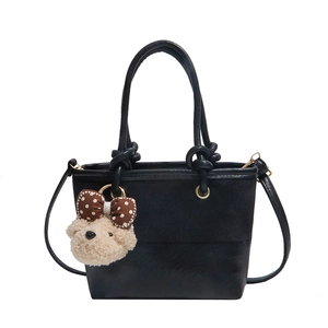 Retro bucket bag in black patchwork suede and leather with cute teddy bear charm
