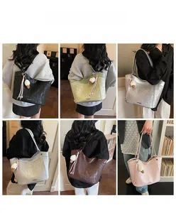 Showcase of large tote bags in six colors featuring ice cream charms and tassels