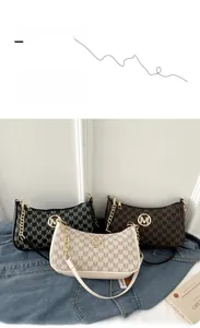 Detailed view of vintage monogram shoulder bags in three colors with gold chain straps