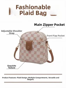 Detail view of woven check phone bag with gold hardware and adjustable strap