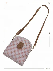 Detail of adjustable leather strap and check pattern phone crossbody bag with snap closure