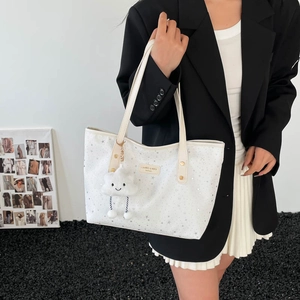 Large capacity cream white tote bag with silver star patterns and cloud charm on model