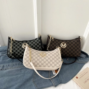 Minimalist M-monogram shoulder bags in black, brown, and cream with gold hardware