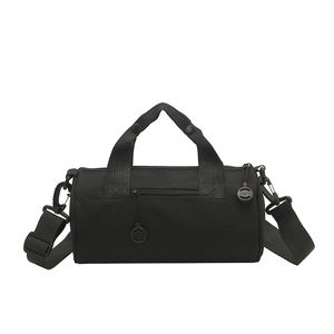 Black waterproof cylindrical travel bag with adjustable shoulder strap and front zipper