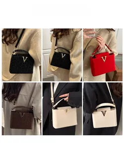 Detailed views of multi-color leopard print crossbody bags with metallic V logo for women