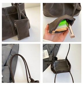 Detail view of large brown suede tote with white stitching and matching zipper pouch