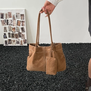 Brown vintage suede tote bag with white decorative stitching and small matching pouch