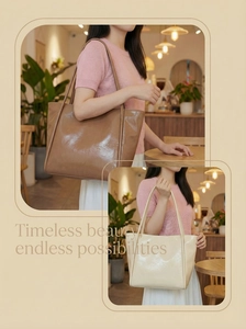 Detail showing glossy faux leather texture of tan and beige tote bags in a cafe