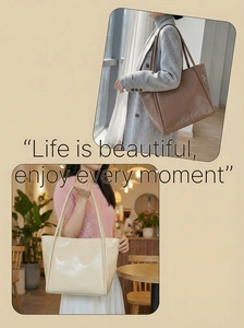 Close-up of brown and beige large tote bags in glossy faux leather finish