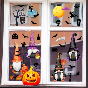 Halloween window stickers featuring gnomes, pumpkins, and bats on a white window frame