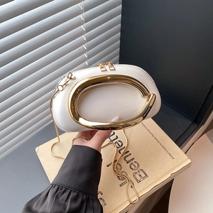White semi-circular evening clutch bag with gold oval handle and snake chain strap