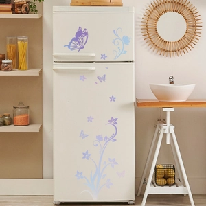 Detailed view of luminous purple butterfly and floral wall decals on a white refrigerator