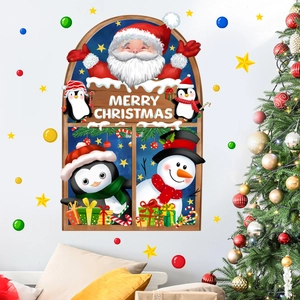 Festive Christmas wall stickers with Santa, snowman and penguins above a living room sofa