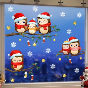 Christmas owl static window clings featuring snowflakes and branches on glass surface
