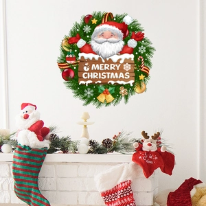 Detail of Christmas wreath window sticker with Santa Claus and Merry Christmas sign