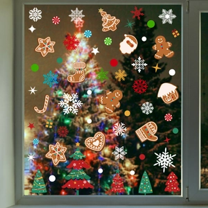 Christmas window stickers featuring gingerbread man, snowflakes and tree on glass
