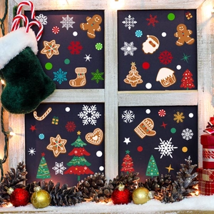 Detailed Christmas window stickers with gingerbread man and snowflake festive designs