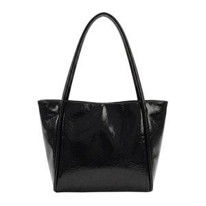 Glossy black patent leather tote bag with long shoulder straps on a clean white background