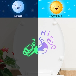 Luminous cartoon smiley face toilet sticker showing glowing effect in dark and daytime view