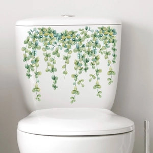 Watercolour green vine wall stickers applied to a white toilet tank for home decoration