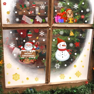 Cozy indoor scene featuring Santa Claus and snowman static window stickers for Christmas