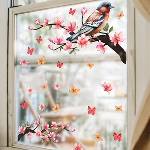 Detailed spring window cling showing realistic birds and butterflies on cherry blossoms