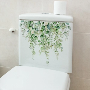 Detailed close-up of green eucalyptus and white floral self-adhesive toilet tank stickers
