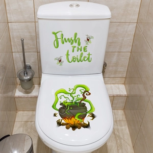 Detail of Halloween toilet stickers with green cauldron and Flush THE toilet ghost design
