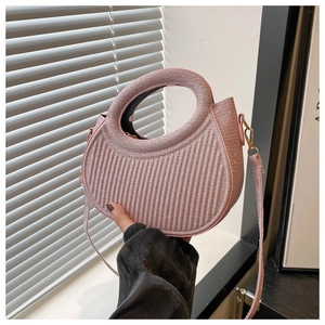 Pink glitter crescent handbag with vertical stripe embossing and round handle
