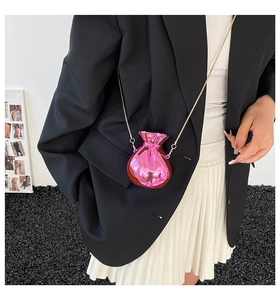 Close-up of pink metallic lucky bag mini crossbody bag with gold chain strap