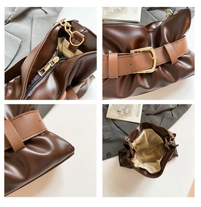 Détail de la fermeture éclair dorée et du cuir plissé marron foncé de ce sac à main chic