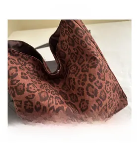 Close-up of leopard print canvas tote bag showing inner lining and detailed stitching