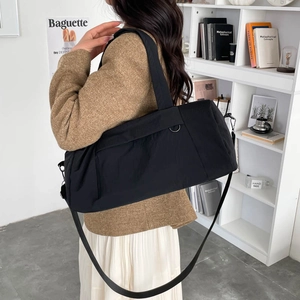Large black nylon travel bag for fitness or daily commuting with adjustable shoulder strap