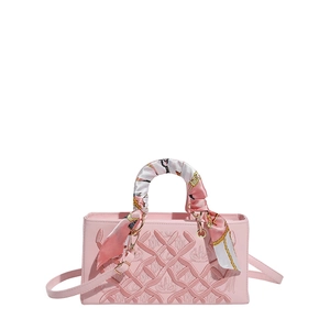 Pink quilted rectangular handbag with floral scarf handle and gold hardware detail