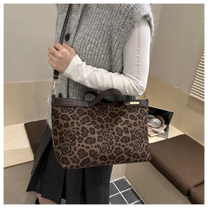 Brown leopard print suede tote bag styled with gray sweater for a vintage autumn look