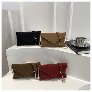 Detail view of envelope chain bags in black, khaki, dark green, and burgundy colors