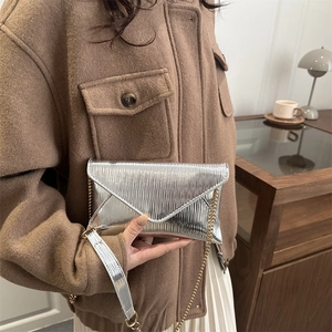 Silver envelope crossbody bag with water ripple texture and gold chain strap