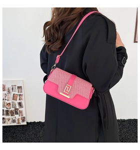 Detail of rose pink crossbody bag with gold Greek Key buckle and silver glitter fabric
