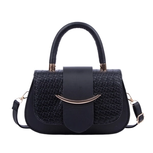 Black crocodile embossed leather handbag with gold trim and detachable shoulder strap
