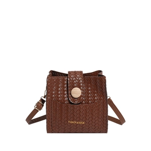Brown woven texture crossbody bucket bag with wood-grain accent and adjustable strap