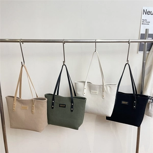 Minimalist corduroy tote bags for women in various colors with metal rivet handles