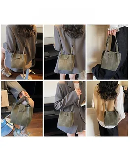 Army green bucket bag with white contrast stitching shown from multiple perspectives