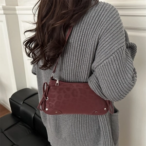 Retro burgundy leopard print underarm bag with bow ribbons and silver rivet details