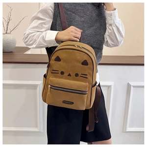Detail of suede leopard backpack with embroidered cat face and fashion zipper pocket